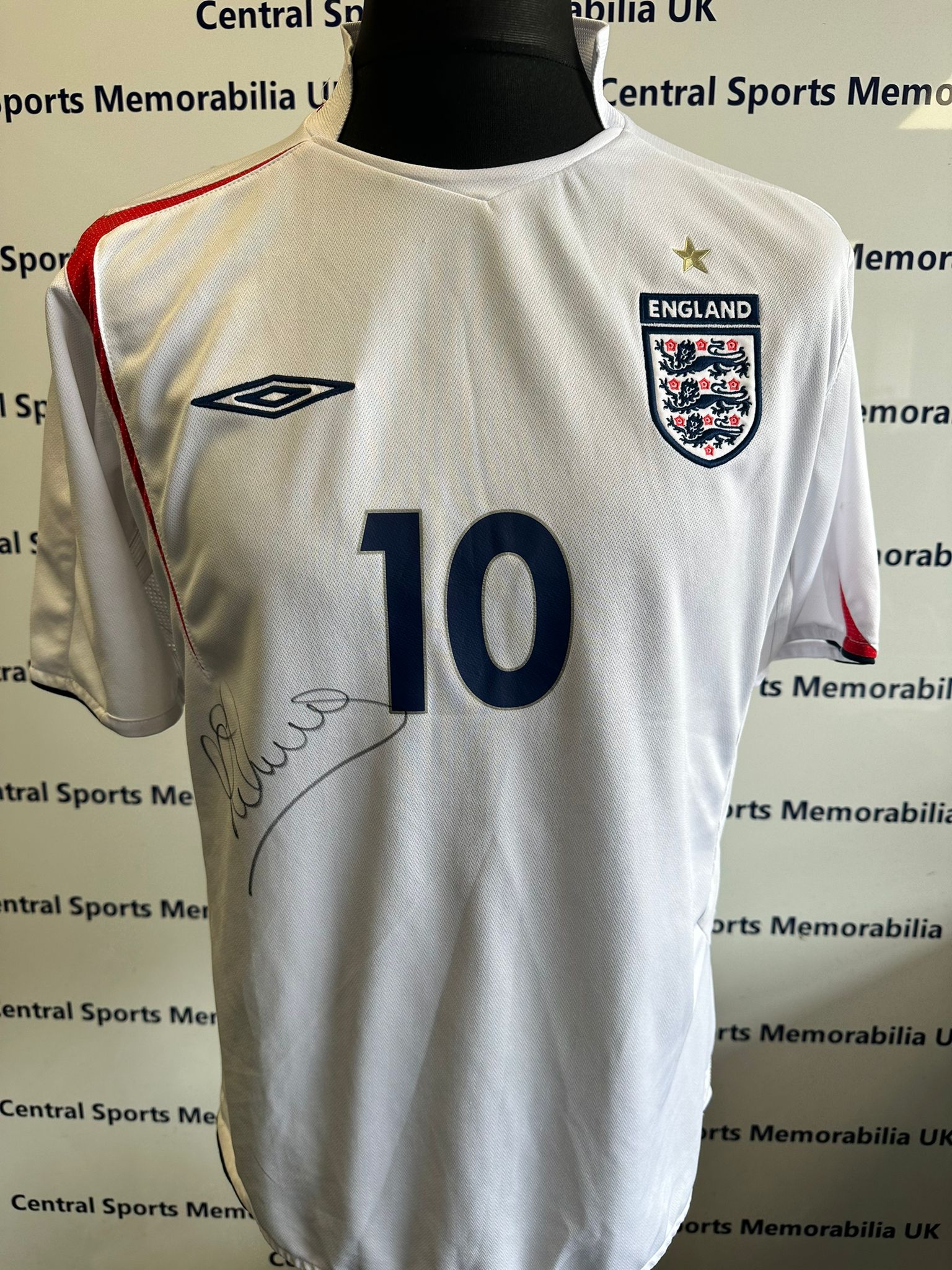 England Replica Shirt Signed front and back by Michael Owen.  Size L (Adult)