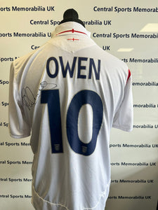 England Replica Shirt Signed front and back by Michael Owen.  Size L (Adult)