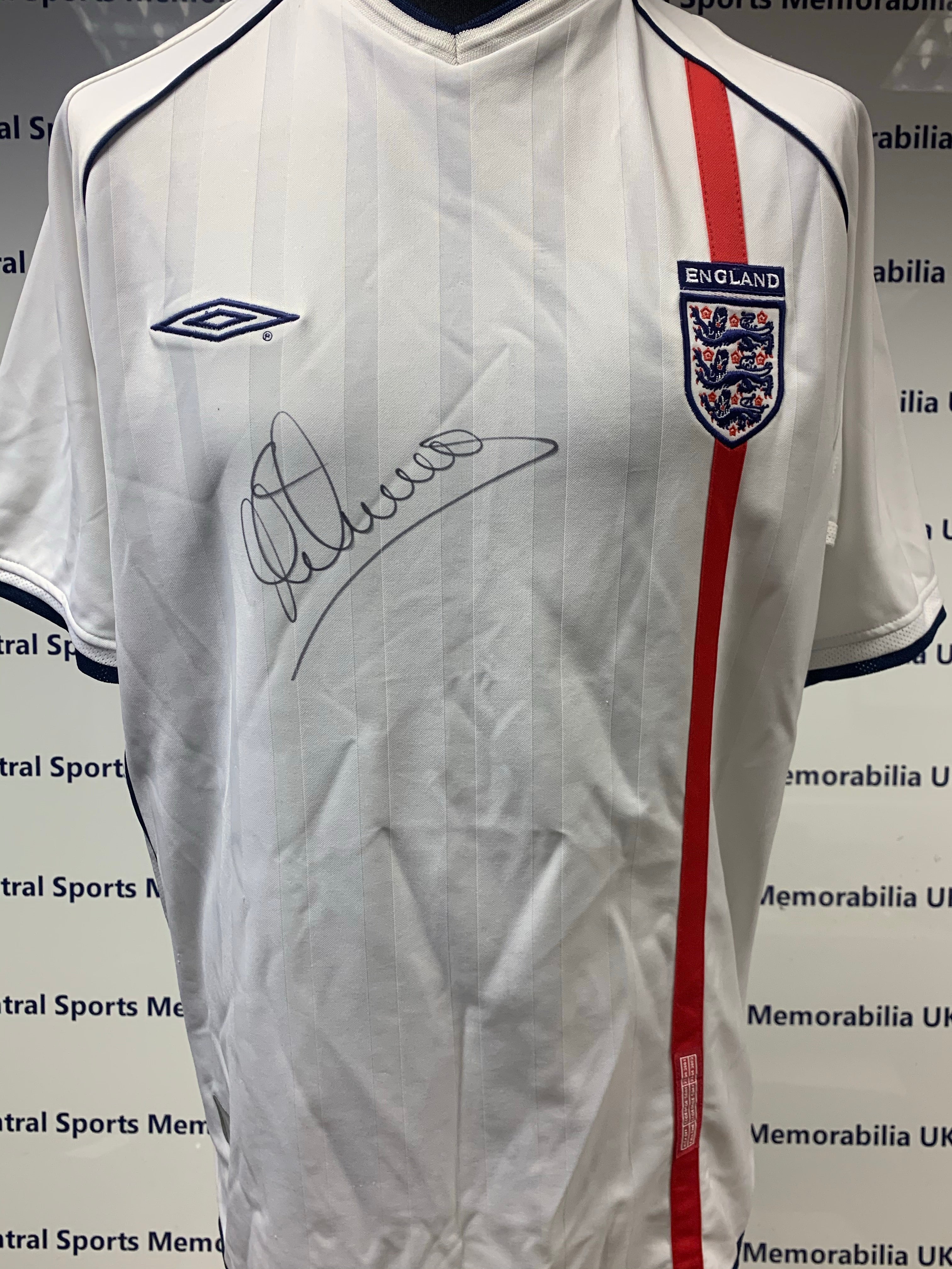 England Replica Shirt Signed by Michael Owen.  Size XL